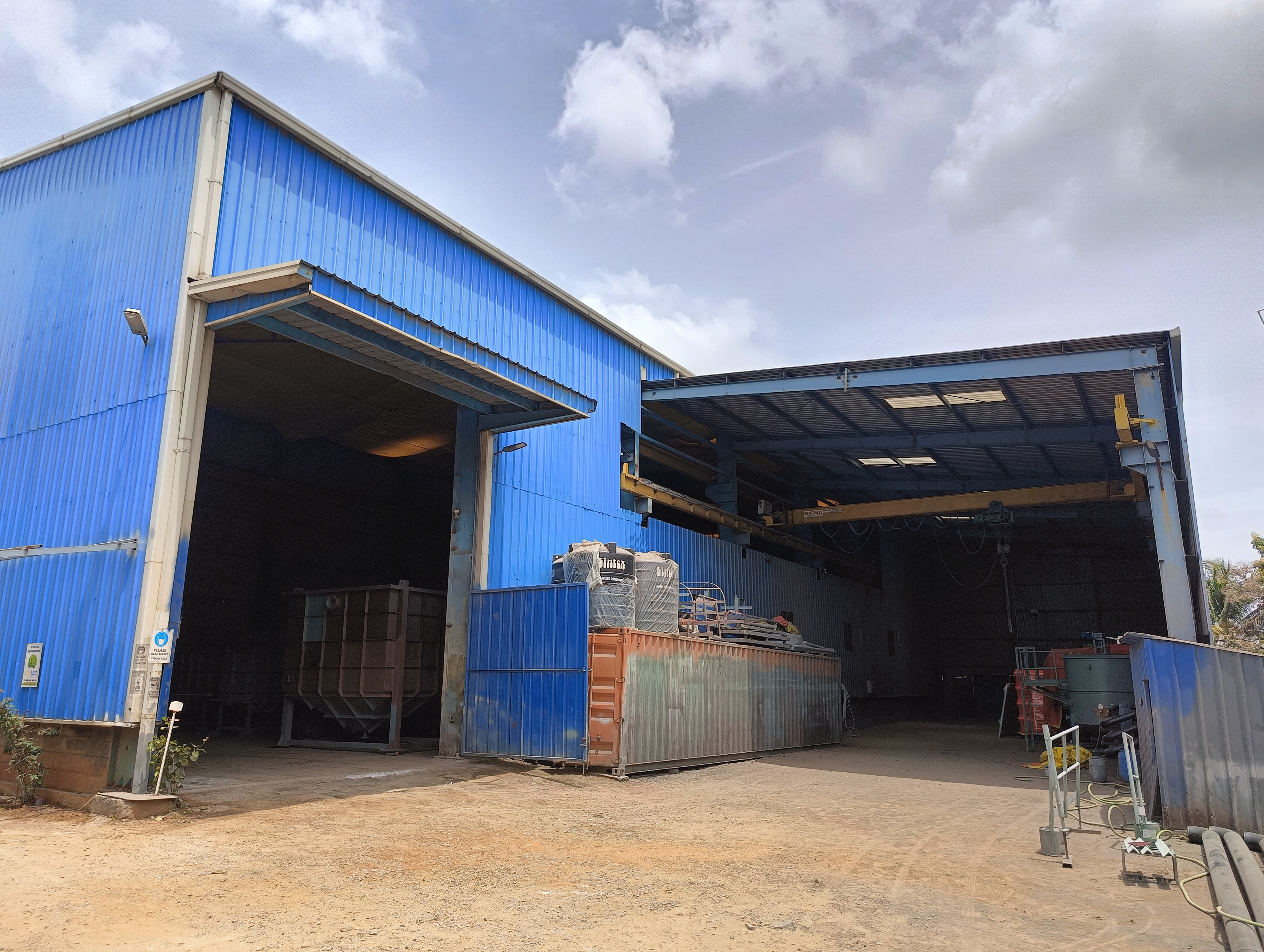 Peenya manufacturing facility exterior with overhead crane